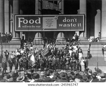 Food Will Win The War. Don\'t Waste It\', exhorts the banner at a rally for the Fourth Liberty Loan Campaign during WWI. New Orleans, October 2, 1918.
