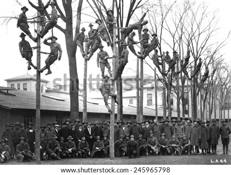 Pole-Climbing training for Students Army Training Corps at the University of Michigan. The uniformed students are in a course for telephone electricians. WWI. Ca. 1918.
