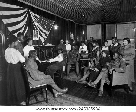 Women honoring African American men about to leave for basic training camp. Newark, New Jersey. WWI. Ca. 1918.
