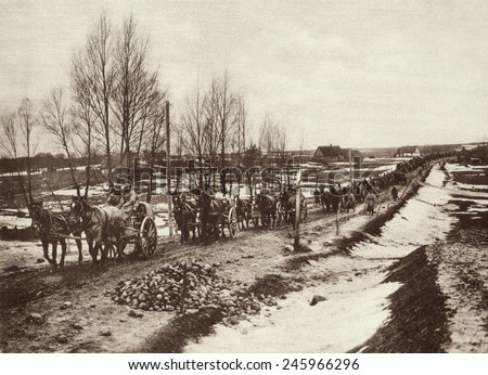 German transport column, miles in length, advancing over the Russian plains in early spring, snow still clinging in patches to the ground. It\'s destination was the battle front near Suwalki. 1915.