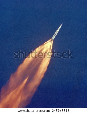 Moon launch. The Apollo 11 Saturn V space vehicle climbs toward orbit after liftoff. In two and a half minutes it was 39 miles above Earth and 55 miles from its launch site. July 16, 1969.