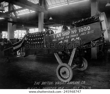 Completed plane at the Dayton-Wright Airplane Company. A sign reads, \'I am Ship No. 1000 and Will Leave for France July 31st, 4:30 PM.\' WWI. July 25, 1918.