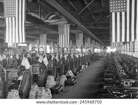 American flags decorate the machine shop for 3 inch artillery shells at the Bethlehem Steel Company during WWI. Ca. 1918.