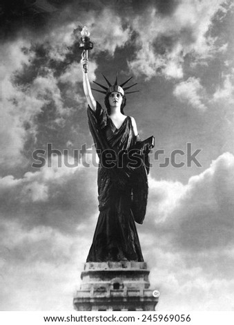 Miss Francis Fairchild, a 1918 debutante of New York, posing as the Statue of Liberty on behalf of the Fourth Liberty Loan to fund WWI government spending. August 1918.