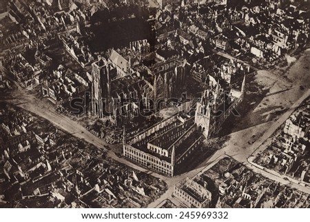 WWI. Aerial view of the ruins of Ypres, Belgium showing the skeletons of St. Martin\'s Cathedral and the Cloth Hall. Ca. 1918.