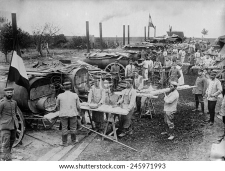 WWI. German field bakery with soldiers cooking bread in mobile ovens near Ypres, Belgium during WWI. 1914.