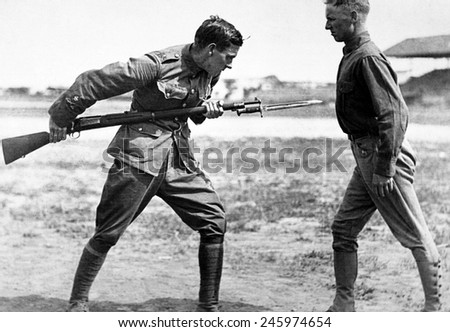 Americans receiving bayonet fighting instruction by English Sgt. Major. At the beginning of WWI, the under staffed U.S. Army welcomed experienced British trainers. Camp Dick, Texas. WWI. Ca. 1917-18.