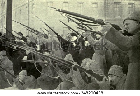 National militia firing on a Czarist police position during Russian Revolution. 1917.