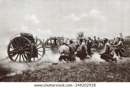World War 1. The fire of a Russian field battery directed by officers kneeling in the rear of their squads. Probably during either the 1914 or 1916 Russian invasion of East Prussia.