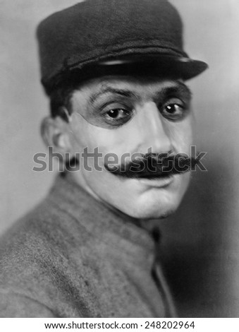 World War 1. French soldier, whose face was disfigured in World War I, wearing a mask of sculpted and painted copper made by American artist Anna Coleman Ladd. July 1918.