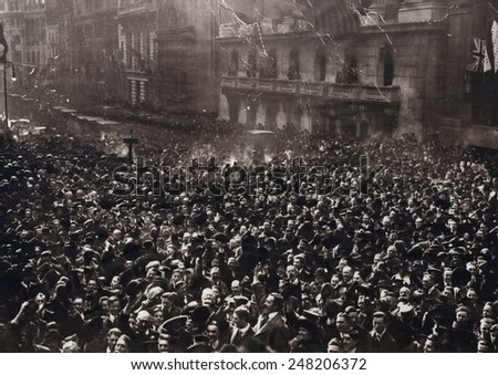 Celebrating American crowd on Peace Monday, Nov. 11, 1918. New Yorkers gathered at Broad and Wall Streets in the Financial District.
