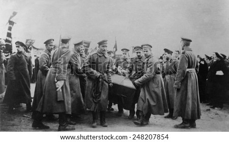 Russian Revolution. Funeral of 182 persons killed by Czarist police on Feb. 26, 1917. Soldiers carrying coffin, St. Petersburg, Russia.