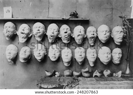 Plaster casts of WW1 soldiers\' mutilated faces in sculptor Anna Ladd studio. 1918. Below them are plaster molds of \'restored\' faces Ladd modeled. France, 1918.