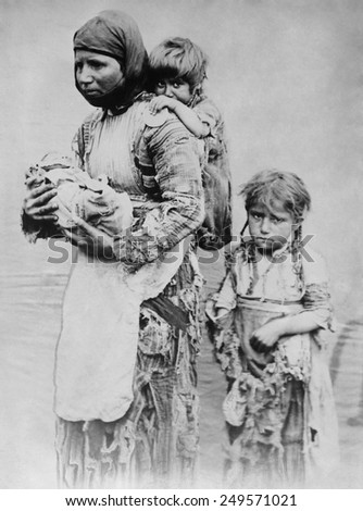 Armenian widow with 3 children seeking help from missionaries in 1899. Her husband was killed in the aftermath of the Armenian Massacres of 1894-1896. She walked 90 miles from Geghi to Harput.