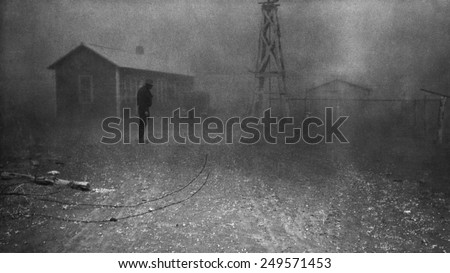 Farmer stands in a dust storm in New Mexico, Spring 1935. Photo by Dorothea Lange.