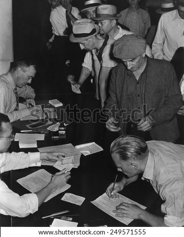 Unemployed men filling out Social Security benefit claims, ca. 1938. In January 1938, new Social Security programs made unemployment compensation available.