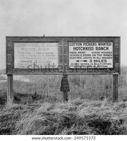 Signs for migrant workers in Spanish and English, Fresno, 1933. Spanish and English readers are directed to separate camps.