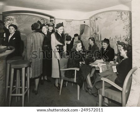 Passengers in a salon on the transatlantic seaplane, \'Rochambeau\', Dec. 1938. The a 68 ton plane, flew from France to NYC in 20 hours treating passengers to all the accommodations of a modern liner.