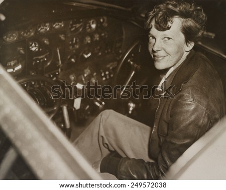 Amelia Earhart sitting in the cockpit of her Lockheed Electra airplane, ca. 1936. In July 1937 Earhart and the airplane were lost over the Pacific Ocean.