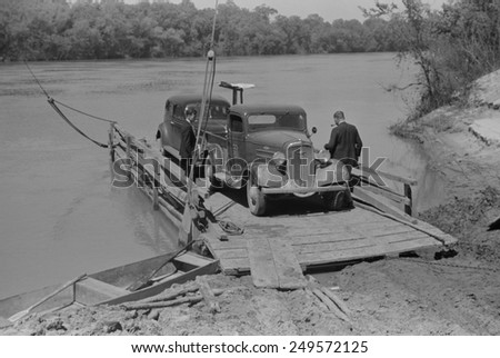 Primitive car ferry at African American community of Gee\'s Bend, Alabama, May 1939. White county government ended the ferry service to discourage voter registration in 1962.