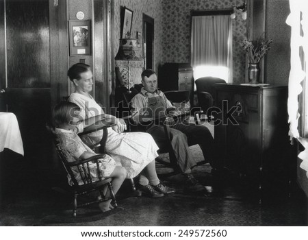 Farm family listening to their radio, Michigan, Aug. 15, 1930. Photo by George Ackerman.