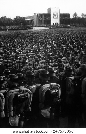 Nazi Party rally in Nuremberg, November 9, 1935. Overview of the mass roll call of SA, SS, and NSKK troops. The SA were the \'Storm Division\' also called the \'Brown Shirts\' or \'Storm Troopers\'.