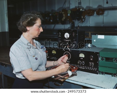 Woman electric wiring technician at Douglas Aircraft Company, Long Beach, California. During World War 2, Oct. 1942.