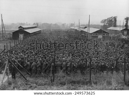 10,000 German prisoners of war line up for lunch at an enclosure in France. The POWs were captured in the 1944 Allied drive through France, during World War 2.