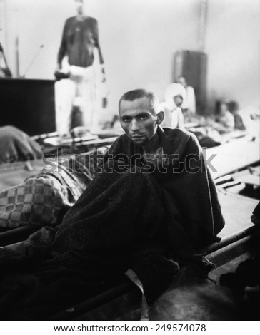 Starving inmate of Gusen concentration camp in Austria after liberation. The Mauthausen-Gusen concentration camp complex was the largest Nazi concentration camp in Austria during World War 2.