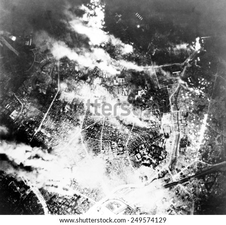 Tokyo burns under B-29 firebomb assault. In this raid, 464 B-29s fire bombed the area immediately south of the Imperial Palace. May 26, 1945.