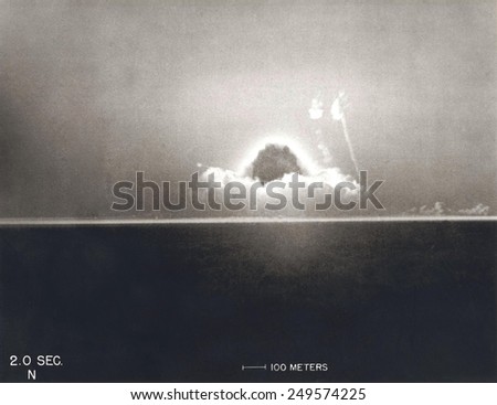 First Atomic Explosion on July 16, 1945. Photograph taken at 2 seconds after the initial Trinity detonation shows the beginning of the Mushroom cloud. Manhattan Project, World War 2.