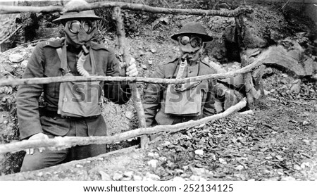 Doughboys wear gas masks in the trenches during WWI. 1918.