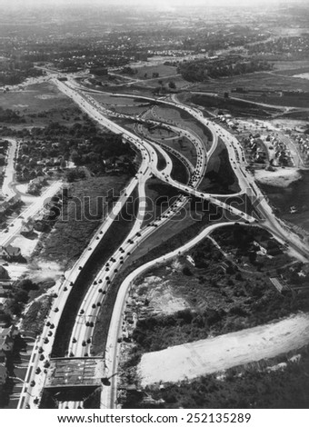 Aerial view of limited access highway on Long Island. The new roads provide access from the growing suburbs to New York City. Ca. 1946.