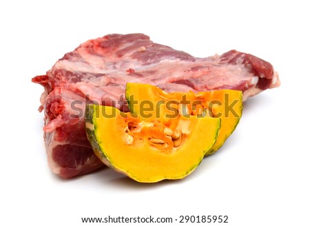 Raw pork chop steak with pepper sea salt and parsley isolated on white - deep focus image