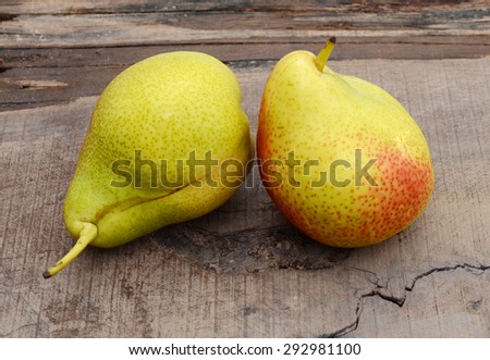 South African forelle pear fruit over on wooden board