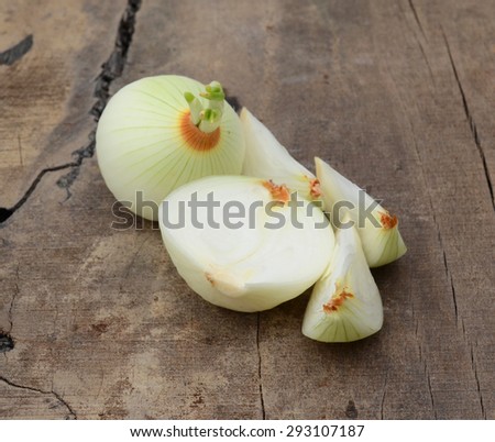 white onion isolated on wooden board
