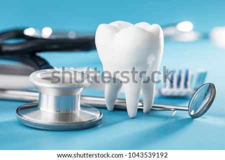 White healthy tooth, different tools for dental care. Dental background.