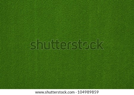 Close-up of green poker table felt background
