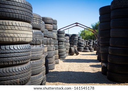 Stack of new tires for sale at a tire store.