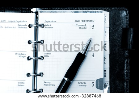 Pocket planner with pen, close up