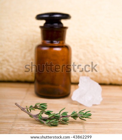 Holistic therapy set, focus around the oil bottle.