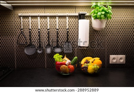 Vegetables, fruits and herbs in a contemporary kitchen.