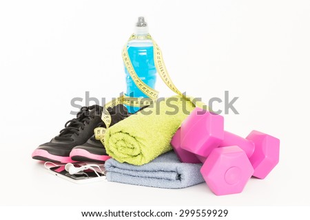 Pair of sport shoes and fitness accessories. White background.