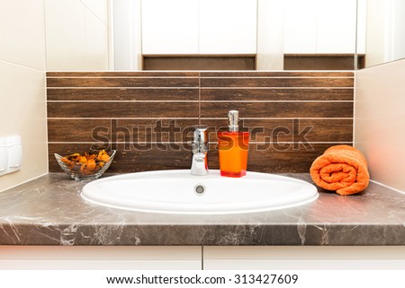 Close up of a wash basin in a modern bathroom interior.