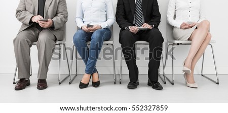 recruitment recruiting hire recruit hiring recruiter interview employment job human room stress stressful position young group formal work chair corporation corporate sitting concept - stock image