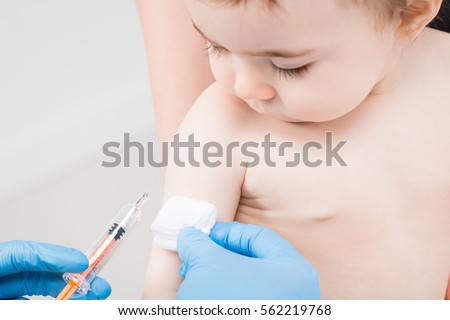 vaccine vaccination child baby doctor injection pediatrician injecting arm health immunization hand hospital needle syringe concept - stock image