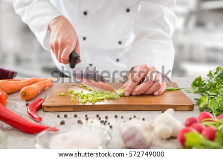 chef cooking food kitchen restaurant cutting cook hands hotel man male knife preparation fresh preparing concept - stock image