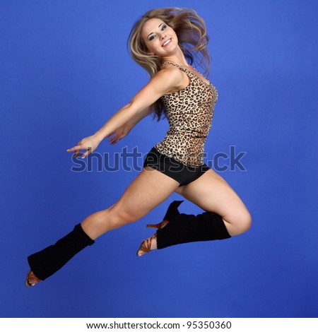 Attractive young woman in the gymnastic pose