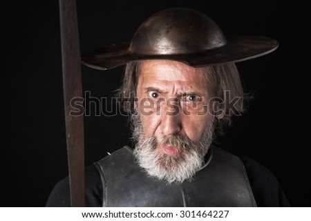 Old bearded man with breastplate and helmet
