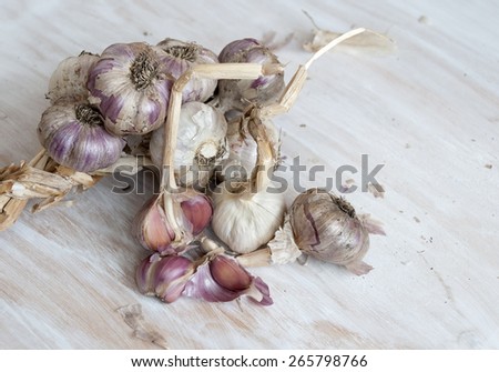 Garlic on the table. Unwashed vegetables, farm product